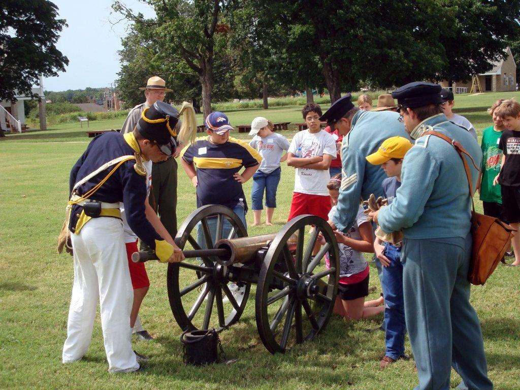 Visitors to Fort Scott National Historic Site watch a cannon demonstration.
