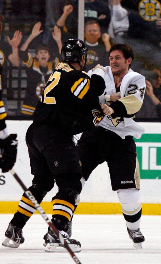 Boston’s Shawn Thornton, left, went after Pittsburgh’s Matt Cooke on Thursday in their first game since Cooke’s controversial hit to the head knocked Bruin Marc Savard from the lineup.
