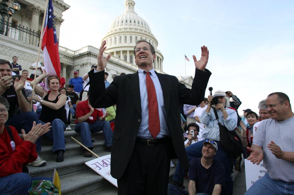 Rep. Jack Kingston, R-Ga., speaks to people demonstrating against the health care bill on the U.S. Capitol steps Saturday. Much about the day was noisy and emotional.