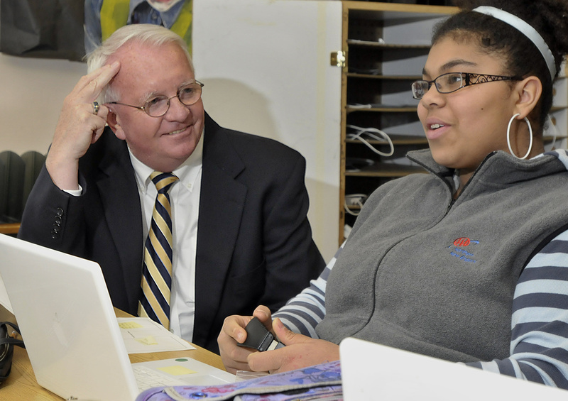 King Middle School Principal Mike McCarthy, Maine’s Middle Level Principal of the Year, gets a briefing on seventh-grader Zoe Yeboah’s recent interview with a civil rights activist in Maine who participated in the civil rights movement in the 1960s.