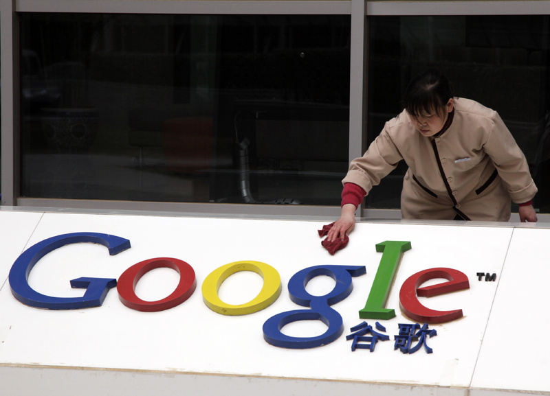 A Chinese worker cleans the Google logo at the Google China headquarters in Beijing, China, on Monday.