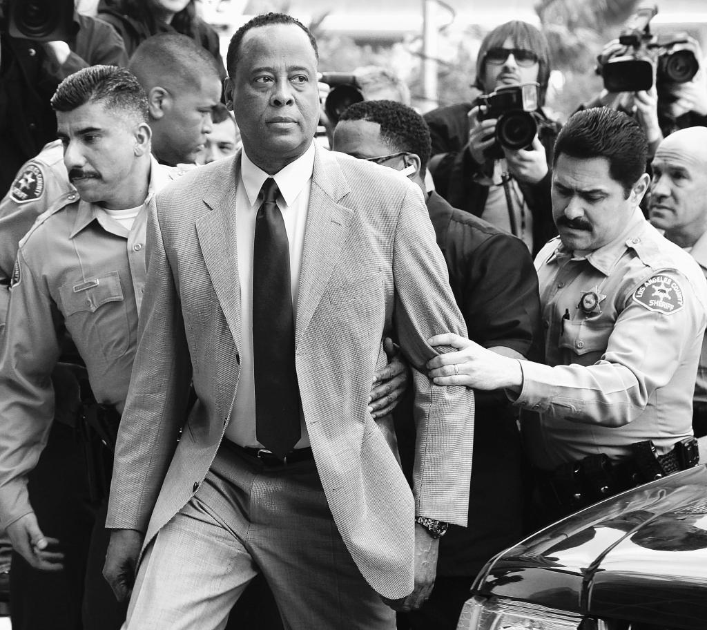 Conrad Murray, Michael Jackson’s doctor, is escorted by Los Angeles County Sheriffs deputies on Feb. 8 as he arrives at the Airport Courthouse to face charges of involuntary manslaughter in the singer’s death on June 25, 2009. Documents obtained by the Associated Press suggest he may have tried to conceal evidence.