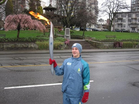 Aidan McKee, an eighth-grade student at Mahoney Middle School in South Portland, carries the torch at the Vancouver Paralympic Winter Games