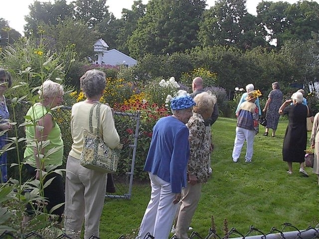Southern Maine Garden Club members tour a garden in this 2008 photo. The members meet monthly and do various downtown beautification and other projects.