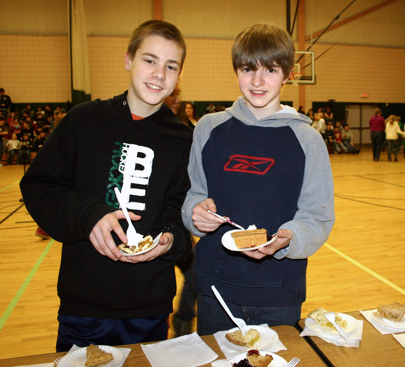 Bonny Eagle Middle School seventh-graders Justin Miles and James Maxwell chose their favorite pie and did math problems during the school’s 16th Annual Pi Day.