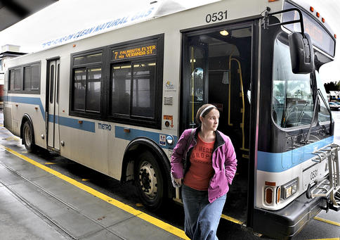 Michelle Andexler of Falmouth gets off the Metro bus in the Falmouth Shopping Center on Wednesday after riding it from Southern Maine Community College in South Portland.