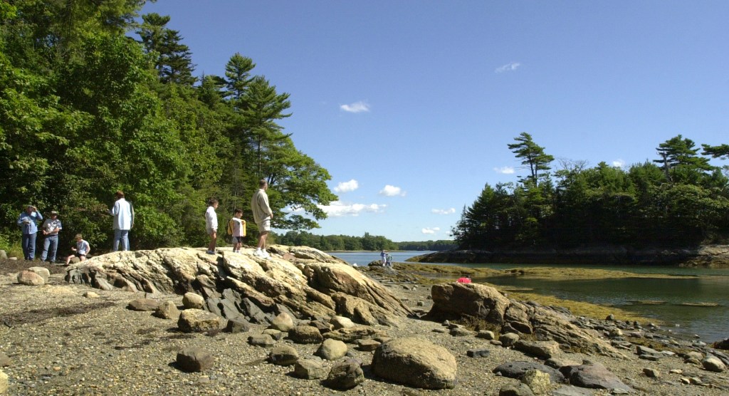 Hikers take in the view at Wolfe’s Neck Woods State Park.