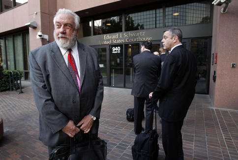 Attorney Michael Williams, left, and Keith Foote with LexisNexis are seen outside the federal courthouse in San Diego, Calif., Thursday, waiting for a hearing on whether more than 200 lawsuits against Toyota will be consolidated before a single judge.