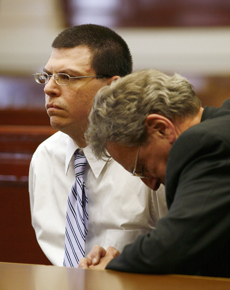 Michael Riley, left, is consoled by his attorney John Darrell on Friday in Brockton, Mass., after he was found guilty of first-degree murder in the prescription drug overdose of his daughter Rebecca in December 2006.