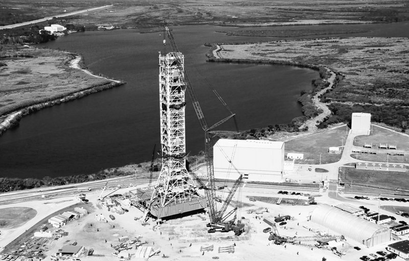 An aerial view shows the final segment of a new mobile launcher attached to the top of a 355-foot steel tower at NASA’s Kennedy Space Center in Cape Canaveral, Fla. The launcher is being constructed to support the Constellation program, the back-to-the-moon effort initiated under President George W. Bush.