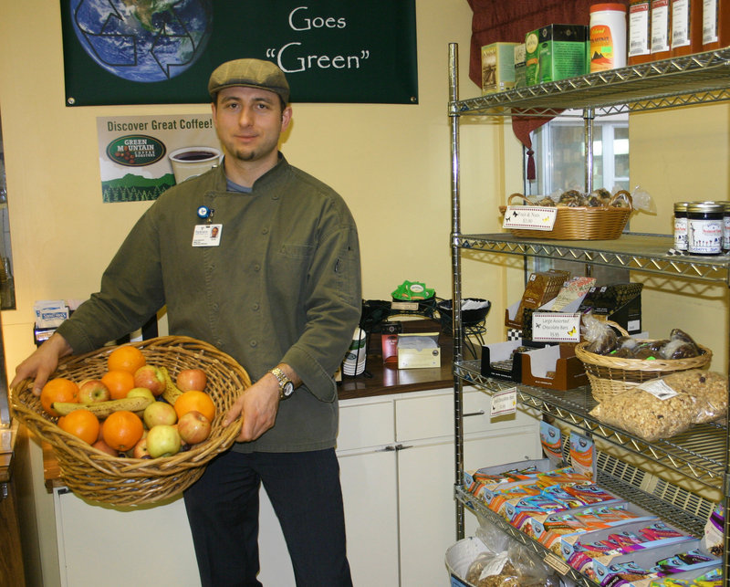 Chef Oleg Opalnyk shows off the free fruit for employees in Parkview Adventist Medical Center's all-vegetarian cafe.