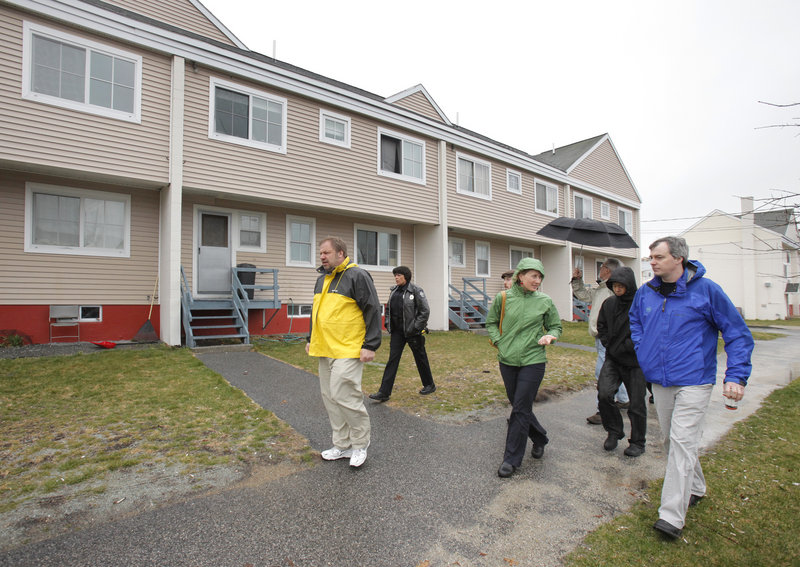Dave Rodgers, right, a Seattle engineer, and Neil Takemoto, a Washington planner, second from right, walk in East Bayside with Portland city planner Molly Casto and the Portland Housing Authority’s David Gagne, left. A public meeting Thursday will focus on a “vision” for East Bayside.