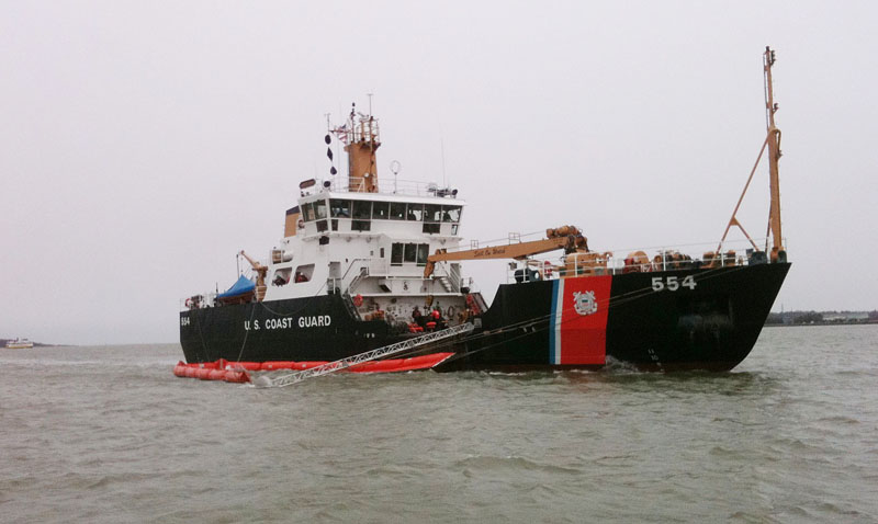 The U.S. Coast Guard vessel Marcus Hanna participates in an oil spill exercise under way in Portland Harbor today. The exercise simulates the cleanup of a spill of more than 70,000 gallons of crude oil.