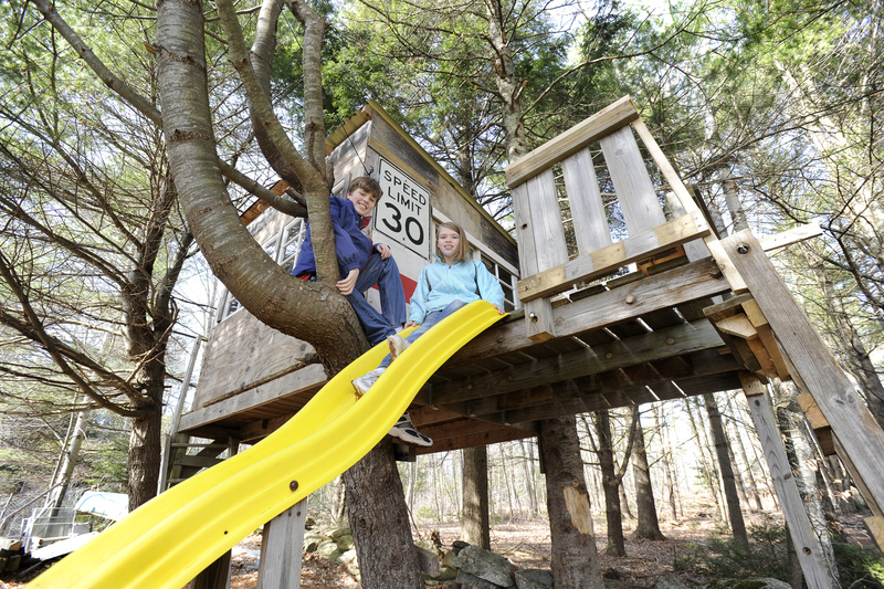 The Andersons of Freeport have a treehouse in their yard. Clifford, 14, and Allie, 11, can climb up and slide down.