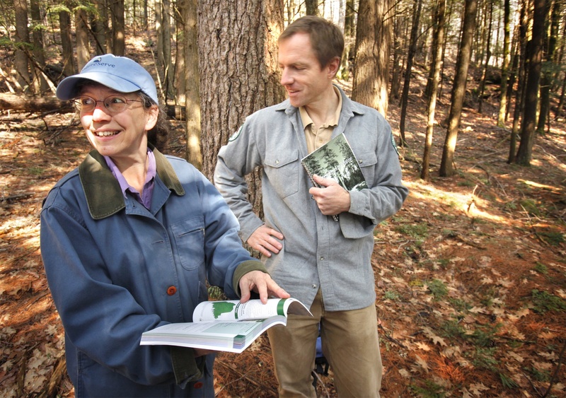 Susan Gawler and Andrew Cutko talk about their book, “Natural Landscapes of Maine,” in a hemlock forest at Bradbury Mountain State Park in Pownal last week. They pointed out three other natural communities besides the hemlock forest during a hike up the slope.