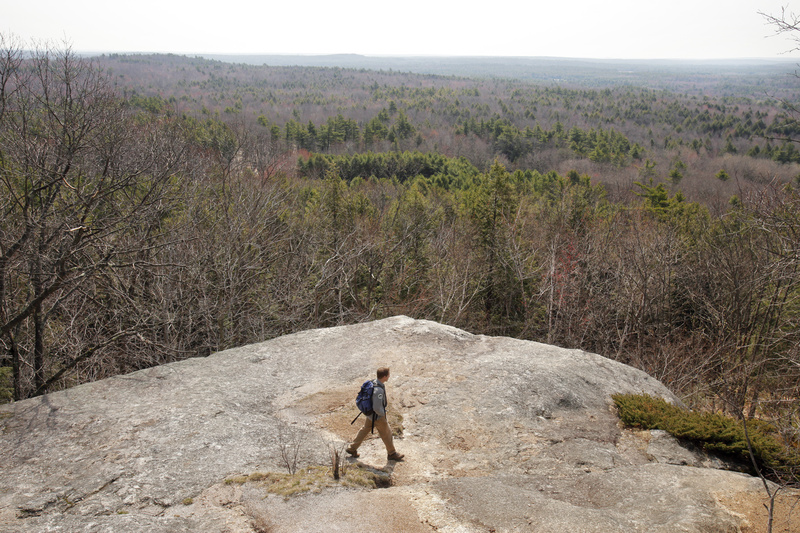 Andrew Cutko walks down Bradbury Mountain in Pownal last week.“Maine is a special place and people with a general appreciation of those places want to put names to them,” he says.