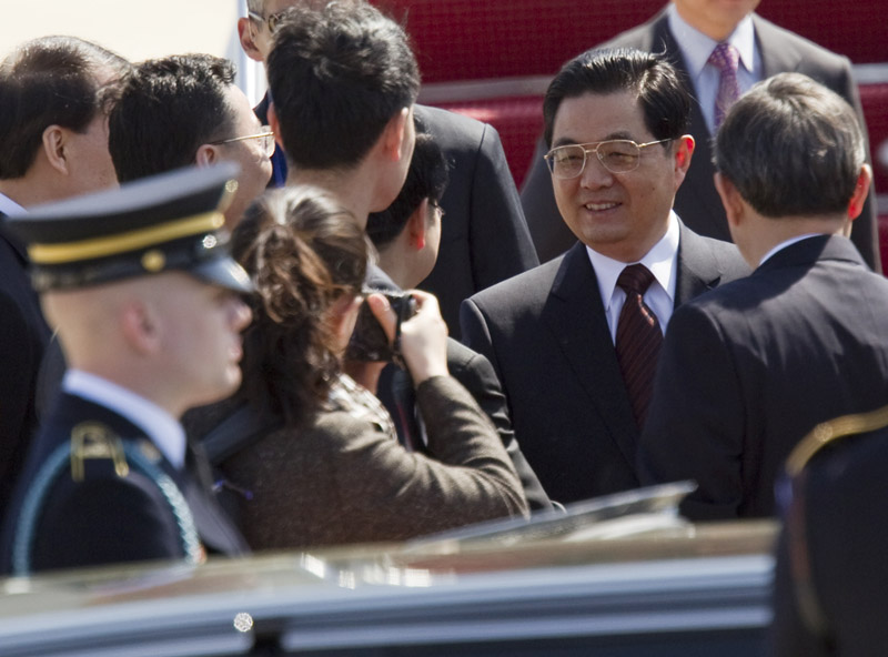 Chinese President Hu Jintao is greeted upon his arrival for the Nuclear Security Summit today, at Andrews Air Force Base, Md.