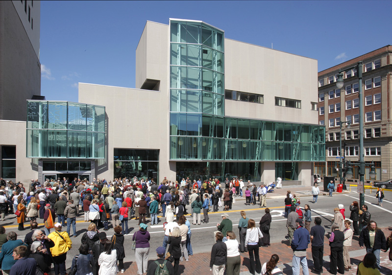 People gather on Congress Street, which was closed off for the grand reopening ceremony of the Portland Public Library on Thursday.