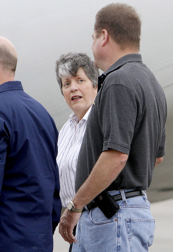 Secretary of the Department of Homeland Security, Janet Napolitano, talks with Terrebonne Parish Sheriff Vernon Bourgeois today before boarding a Coast Guard plane to fly over the Gulf to examine the oil spill.