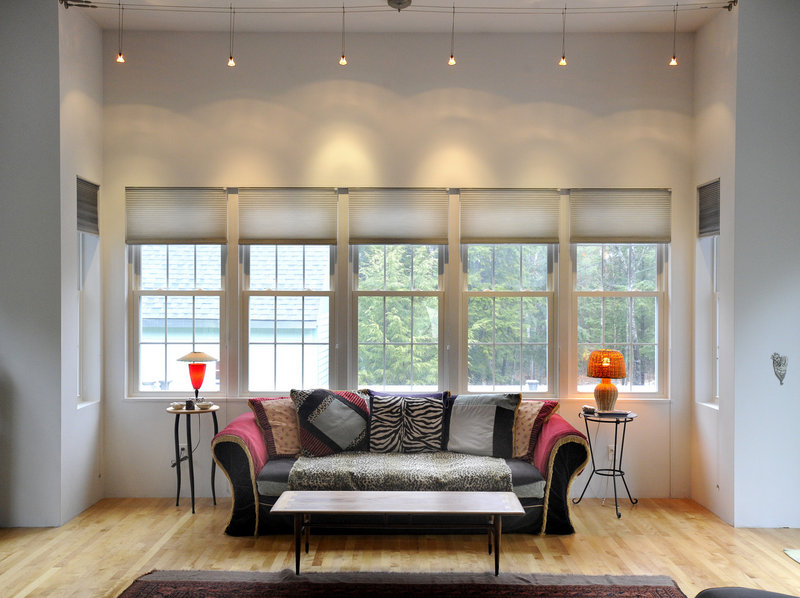 An attractive sitting area is awash in light thanks to a bank of windows.