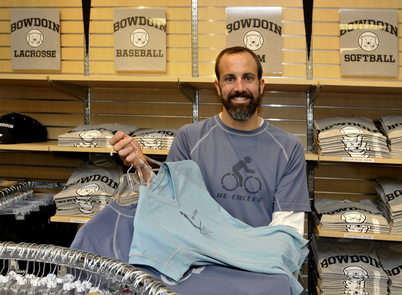 Jeremy Litchfield, seen at the Bowdoin College Store, holds workout gear made from recycled products by his Brunswick-based company, Atayne.