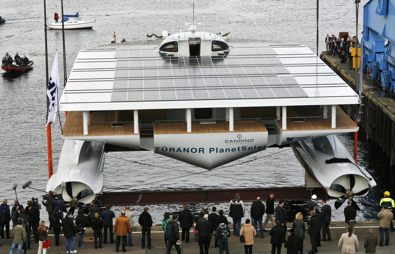 The solar-powered yacht “Planetsolar” yacht is launched at Kiel, northern Germany, on Wednesday. Six years in the building, the catamaran-style vessel now will undergo testing and prepping for a 140-day world tour starting in 2011.