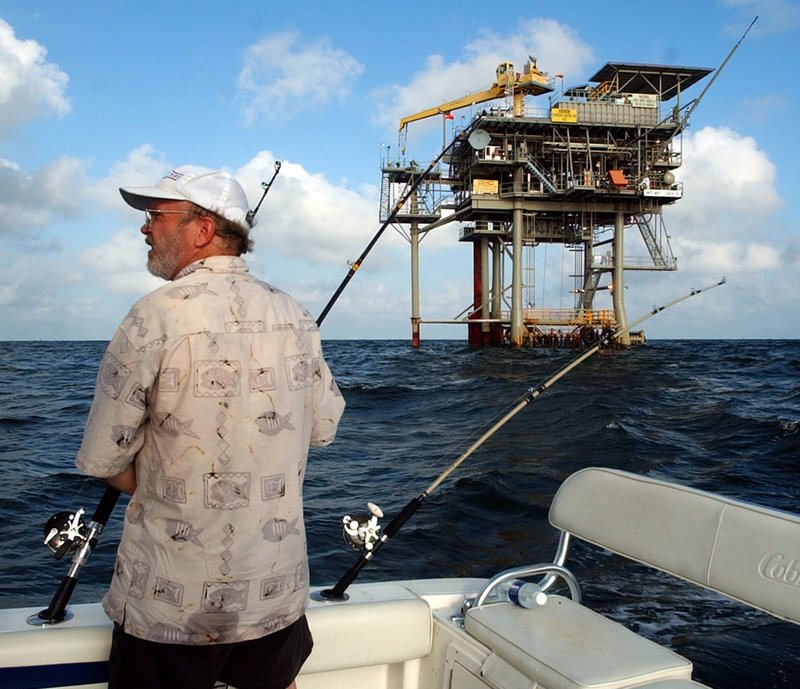 A fisherman trolls the Gulf of Mexico near a natural gas well off the Alabama coast near Gulf Shores, Ala. In announcing his new offshore drilling policy Wednesday, President Obama said he wants to give the petroleum industry access to the southern Atlantic coastline, the eastern Gulf of Mexico and more of Alaska’s coast.