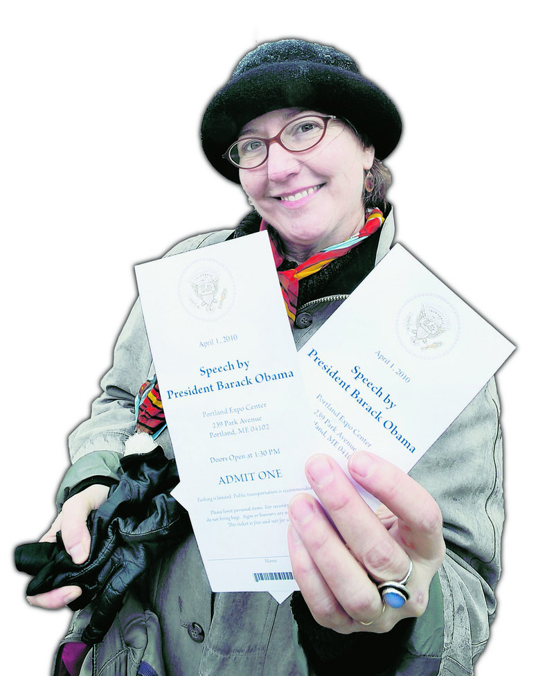 Jewelz Dellger of Portland holds the pair of tickets she scored Wednesday for today’s presidential speech at the Portland Expo.