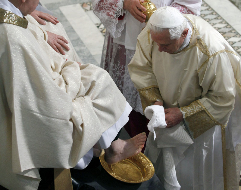 Pope Benedict XVI washes the foot of a layman in the Basilica of St. John Lateran in Rome Thursday. The ceremony symbolizes humility and commemorates Jesus’ last supper with his 12 apostles.