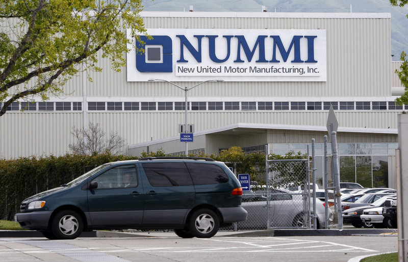 A worker leaves the New United Motor Manufacturing Inc. plant in Fremont, Calif., on Thursday, the last day of operations for the plant in Fremont. The Nummi plant, established in 1984 as a joint venture between GM and Toyota Motors Corp., employed 4,700 workers.