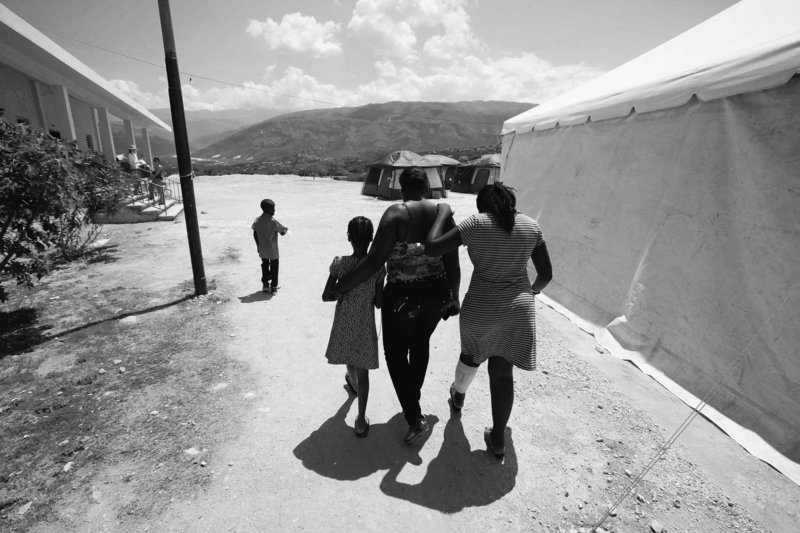 Children walk at the Albert Einstein Hospital north of Port-au-Prince on Wednesday. Aid workers say they are having a difficult time connecting displaced children with their parents.
