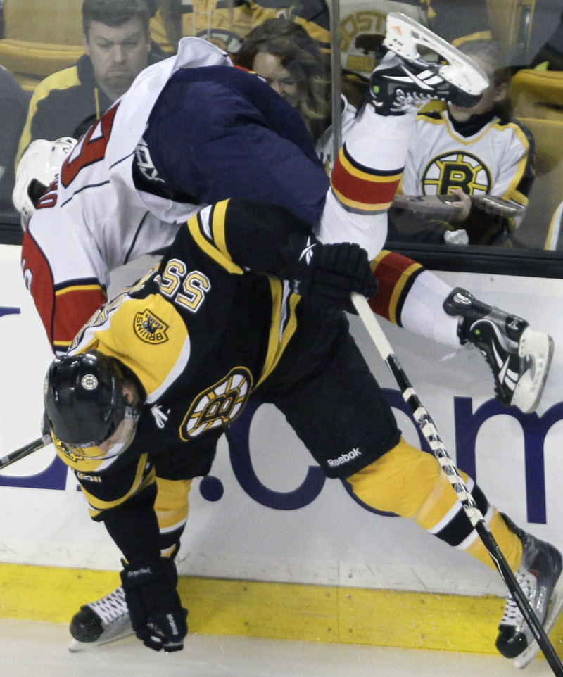 Bruins defenseman Johnny Boychuk upends Florida’s Victor Oreskovich during the Panthers’ 1-0 win Thursday night in Boston.