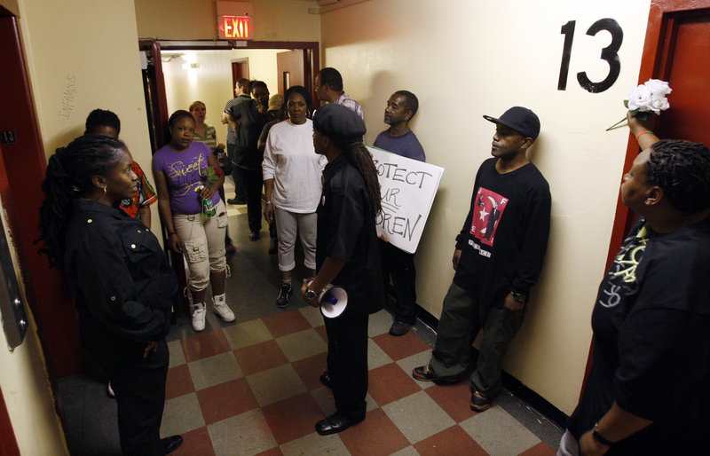 Residents and others gather in a Rowan Tower hallway, left, to protest the March 28 gang-rape of a 7-year-old girl in Trenton, N.J. Police are certain residents know who participated in the crime, but expect little help from them because of the fear of retaliation.