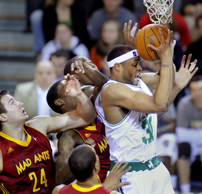 Maurice Ager of the Maine Red Claws pulls down an offensive rebound in traffic Friday night before scoring on the put-back. It wasn't enough to prevent the Red Claws from suffering a 105-92 loss to the Fort Wayne Mad Ants.