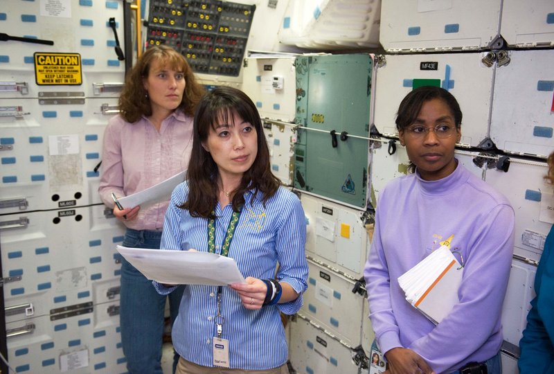 NASA astronauts, from left, Dorothy Metcalf-Lindenburger, Naoko Yamazaki and Stephanie Wilson train at the Space Vehicle Mock-up Facility at NASA’s Johnson Space Center in Houston. A fourth woman, Caldwell Dyson, is already aloft.