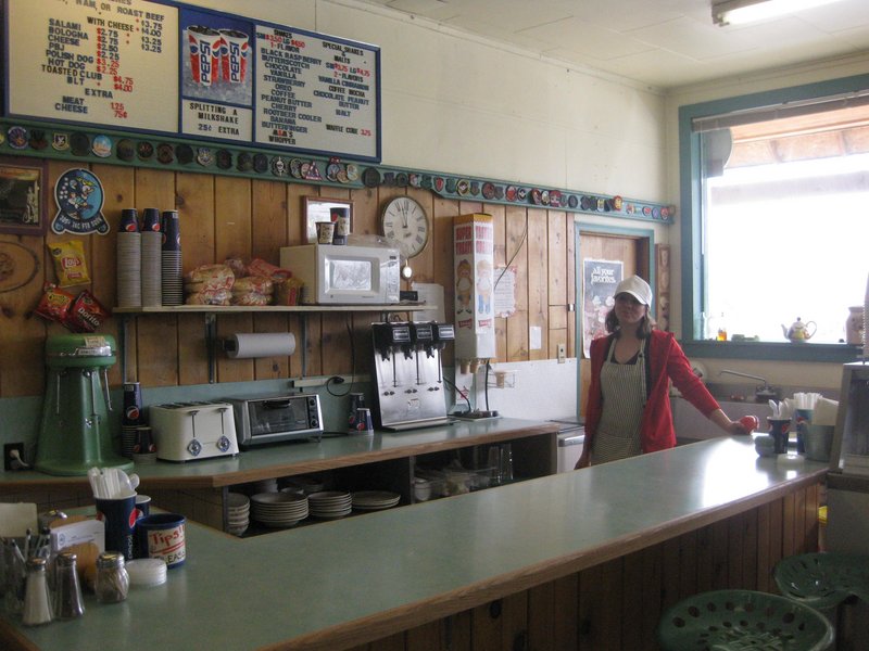 Jancy Kowalski stands behind the counter at Judith Gap Mercantile, where she makes milkshakes for Air Force service members who maintain missiles housed in Judith Gap, Mont.
