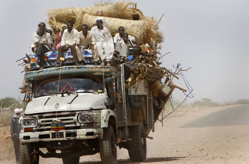A truck loaded with new refugees enters Zamzam refugee camp, outside the Darfur town of El Fasher, in Sudan last month. Disarray in Sudan's elections could end up fueling violence in Darfur and the south.