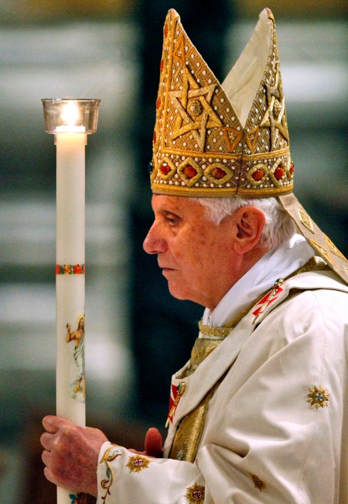 Pope Benedict XVI walks with a candle during the Easter Vigil Mass at the Vatican on April 3. One reader called a decision by the Catholic Diocese of Portland to revoke funds to a group that serves the homeless “the last straw in the long string of ... reprehensible acts and decisions” by the local and world church hierarchy.