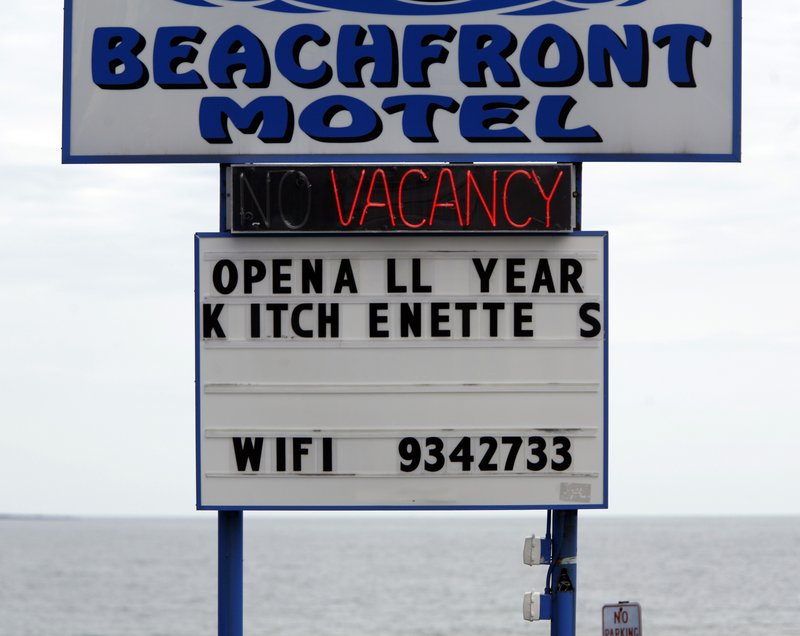 A vacancy sign is displayed at a motel in Old Orchard Beach. Water consumption is down partly because manufacturers have closed or are cutting back, tourism has fallen and the real estate market is in the doldrums.