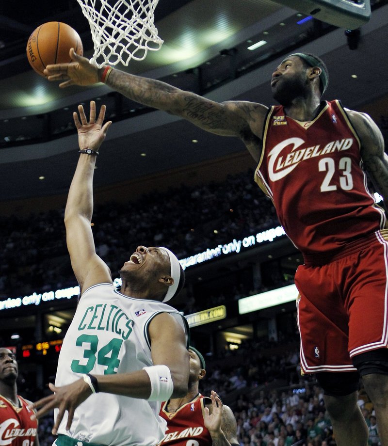 Paul Pierce, left, of the Celtics draws a foul by Cleveland’s LeBron James during Sunday’s game at Boston. Pierce had 16 points in the Celtics’ 117-113 victory.