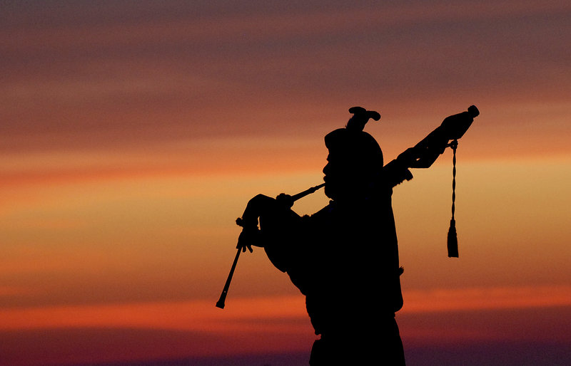David Smart of Scarborough plays the bagpipes during the Easter sunrise service at Fort Williams Park.