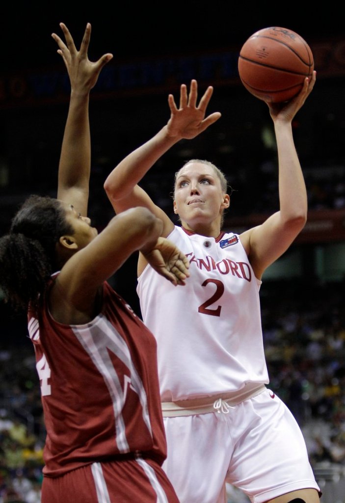 Jayne Appel of Stanford shoots over Oklahoma’s Abi Olajuwon during an NCAA women’s semifinal Sunday night. Stanford reached the final with a 73-66 victory.