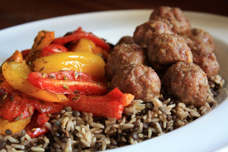 Curried lamb meatballs with roasted peppers and brown rice.