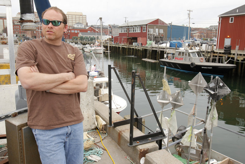 At the Portland Fish Pier, Rob Odlin talks about new limits on the amount of fish groundfishermen will be allowed to catch. The 75 percent of his income that comes from groundfishing will fall drastically, he predicted. Regulators say fish stocks need protection.