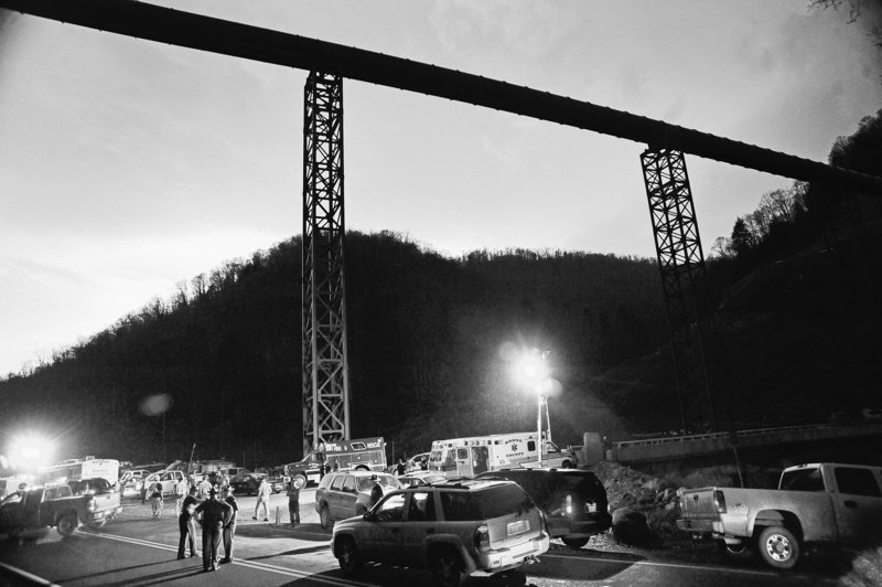 State police direct traffic at the entrance to Massey Energy’s Upper Big Branch mine in Montcoal, W.Va., Monday, when an explosion killed at least 25 workers. The blast is believed to have been caused by a buildup of methane.