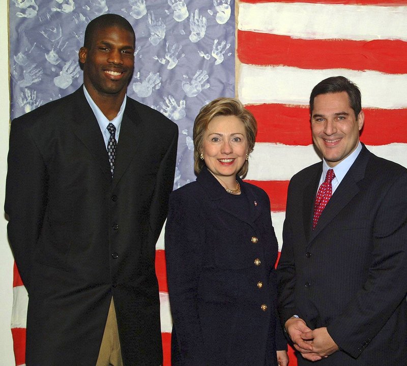 Kwame James, left, is shown in an undated photo with his lawyer Michael Wildes and then-Sen. Hillary Rodham Clinton, D-N.Y., who took an interest in his quest to become a U.S. citizen. The process took 10 years.