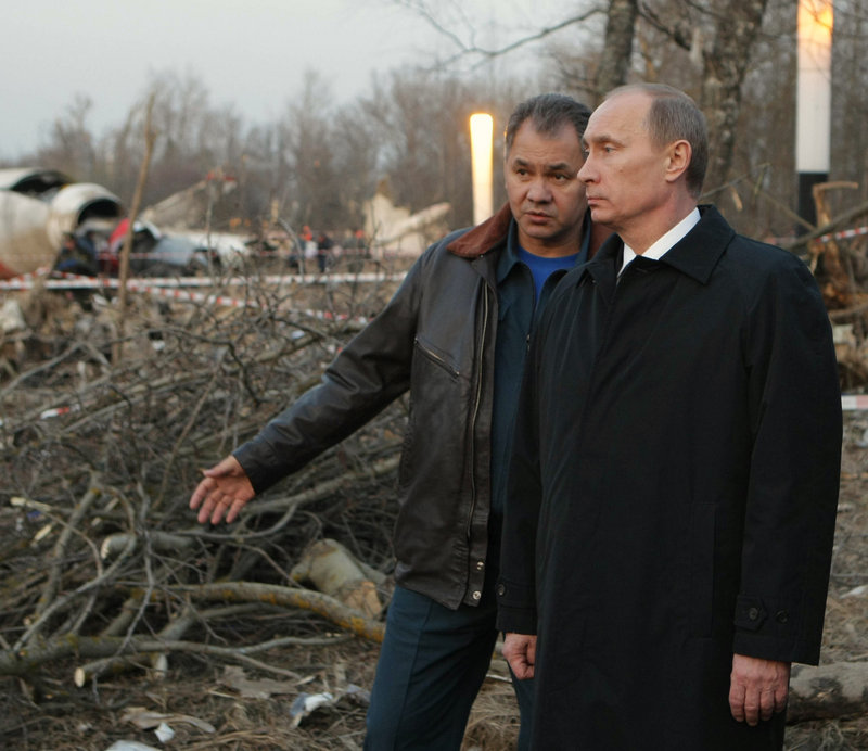 Russian Prime Minister Vladimir Putin, right, and Emergency Situations Minister Sergei Shoigu visit the crash site of the plane in which Polish President Lech Kaczynski died, near Smolensk, western Russia, on Saturday.