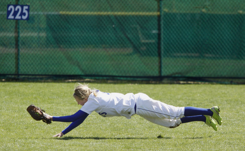 Danyelle Shufelt makes a diving catch in right field for St. Joseph’s in the fifth inning of the first game of a doubleheader Saturday against Pine Manor. The Monks rallied for a 10-9 victory, then completed the sweep by beating the Gators 8-6 in the second game to up their win streak to 17.