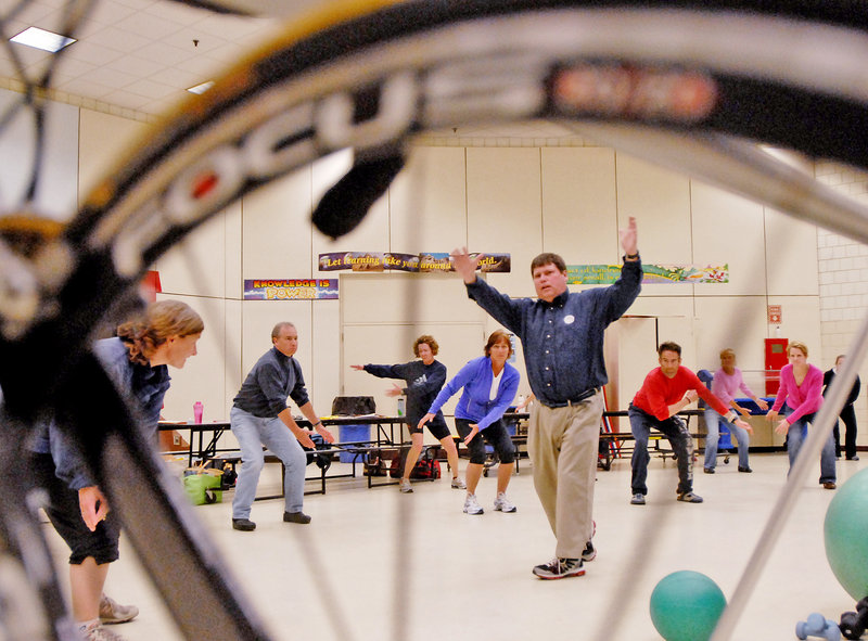 Tim Drown of To Be a Champion leads training for swimmers as part of a triathlete clinic at the Riverton Community Center Pool in Portland on Sunday. The aspiring triathlon competitors could also take part in a running seminar and a bike-fit clinic.