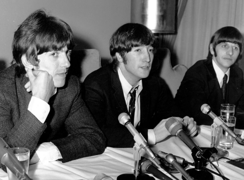 On Aug. 11, 1966, in Chicago, Beatle John Lennon, flanked by bandmates George Harrison, left, and Ringo Starr, apologizes for saying that “the Beatles are more popular than Jesus.”